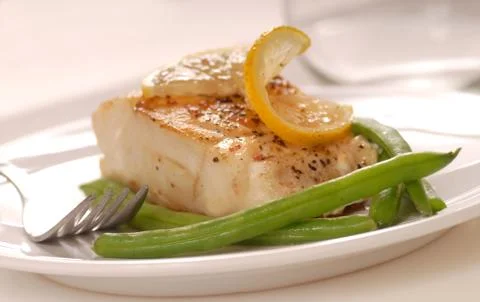 Cod with green beans Stock Photos