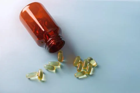 Cod liver oil capsule ,fish oil ,food supliment with omega 3 ,heart care . Stock Photos