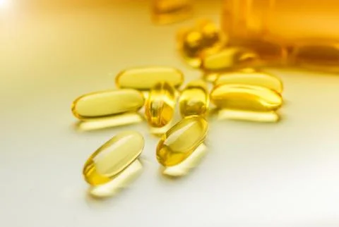 Cod liver oil omega 3 gel capsules isolated on white background Stock Photos