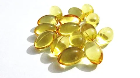 Cod liver oil  or fish oil gel capsules . Stock Photos