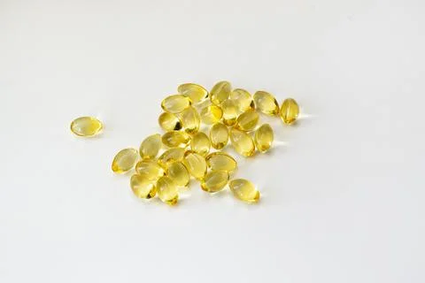 Cod liver oil vitamin e soft gel capsules on white background Stock Photos