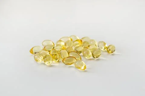 Cod liver oil vitamin e soft gel capsules on white background Stock Photos
