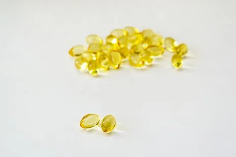 Cod liver oil vitamin e soft gel capsules on white background Stock Photos