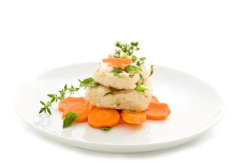 Cod over carrots isolated Stock Photos