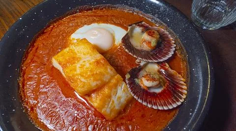 Cod Stewed with Tomato, Egg and Scallops, Spain Stock Photos