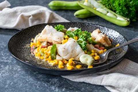 Cod, sweetcorn and broad beans succotash Foto stock