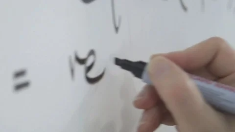 Code being written on a whiteboard in black. Stock Footage 72265517