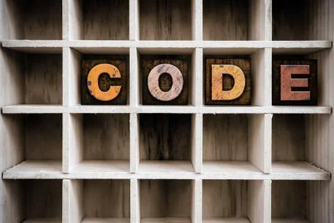 Code Concept Wooden Letterpress Type in Draw Stock-Fotos