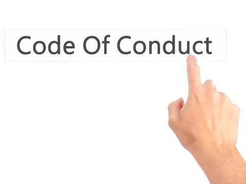 Code Of Conduct - Hand pressing a button on blurred background concept on vis Stock Photos