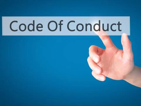 Code Of Conduct - Hand pressing a button on blurred background concept on vis Foto stock