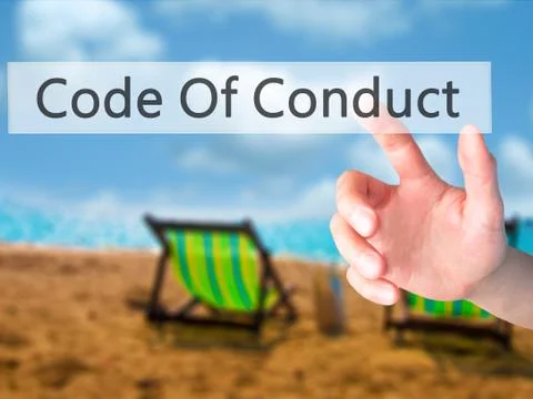Code Of Conduct - Hand pressing a button on blurred background concept on vis Stock Photos