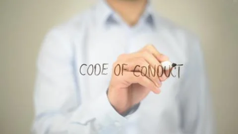 Code of Conduct, Man writing on transparent screen Stock Photos