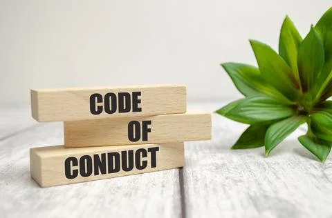 Code of conduct symbol. Concept words Code of conduct on wooden blocks on whi Stock-Fotos