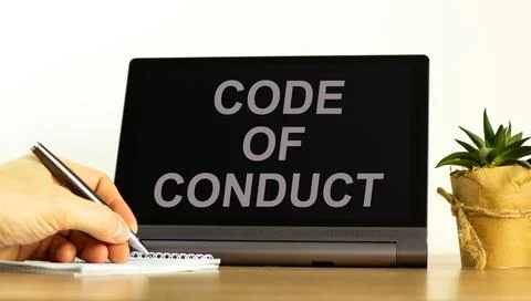 Code of conduct symbol. Tablet with words 'code of conduct'. Businessman hand Stock-Fotos