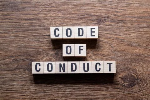 Code of conduct - word concept on building blocks, text Stock Photos