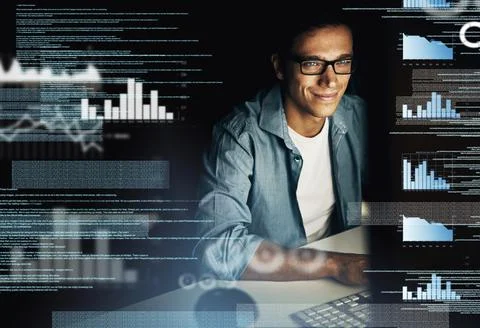 In the code cracking business. a young computer programmer looking through data Stock Photos