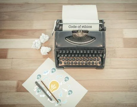 Code of ethics against typewriter and paper on table in office Stockfoto's