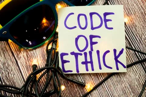 Code of ethics handwritten on a light vanilla note paper with blue color. Two 写真素材