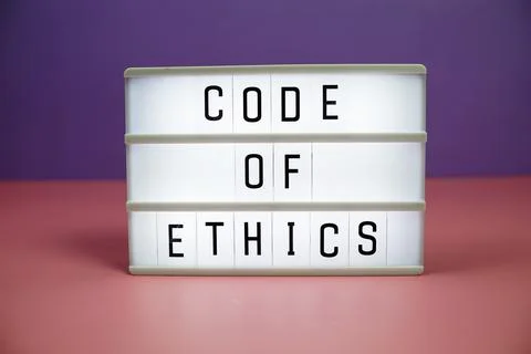 Code of Ethics letterboard text on LED Lightbox on pink and purple background Stock Photos