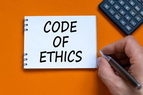 Code of ethics symbol. Businessman writing words 'Code of ethics' on white no 写真素材