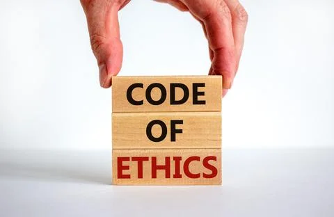 Code of ethics symbol. Concept words 'Code of ethics' on wooden blocks on a b Foto stock