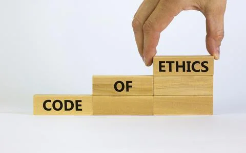 Code of ethics symbol. Concept words 'Code of ethics' on wooden blocks on a b Fotos de archivo