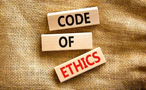Code of ethics symbol. Concept words Code of ethics on wooden blocks on a bea Stock-Fotos
