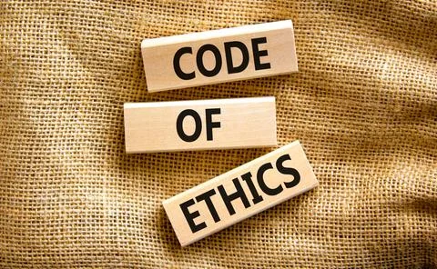 Code of ethics symbol. Concept words Code of ethics on wooden blocks on a bea Foto stock