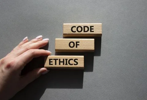 Code of ethics symbol. Concept words Code of ethics on wooden blocks. Beaut.. Stock Photos