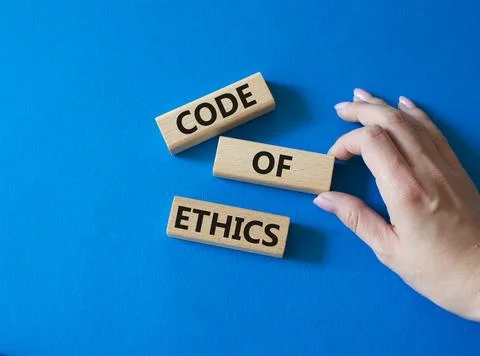 Code of ethics symbol. Concept words Code of ethics on wooden blocks. Beaut.. Stock Photos