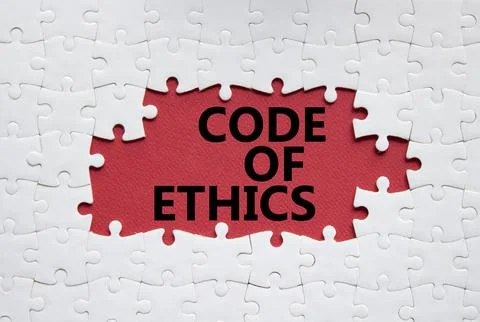 Code of ethics symbol. Concept words Code of ethics on white puzzle. Beauti.. Fotos de archivo