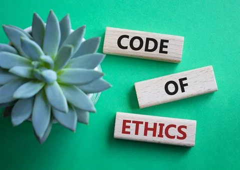 Code of ethics symbol. Concept words Code of ethics on wooden blocks. Beautif Fotos de archivo