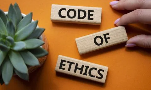 Code of ethics symbol. Concept words Code of ethics on wooden blocks. Beaut.. Stock Photos
