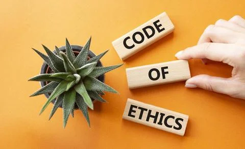 Code of ethics symbol. Concept words Code of ethics on wooden blocks. Busin.. Stock Photos