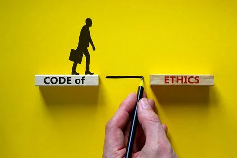 Code of ethics symbol. Wooden blocks with words 'Code of ethics'. Businessman Foto stock