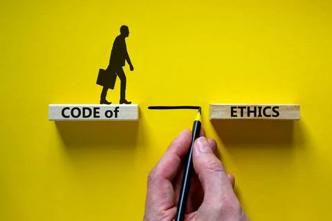 Code of ethics symbol. Wooden blocks with words 'Code of ethics'. Businessman Stock-Fotos