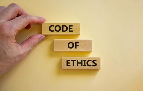 Code of ethics symbol. Wooden blocks with words 'Code of ethics'. Beautiful w Stock Photos