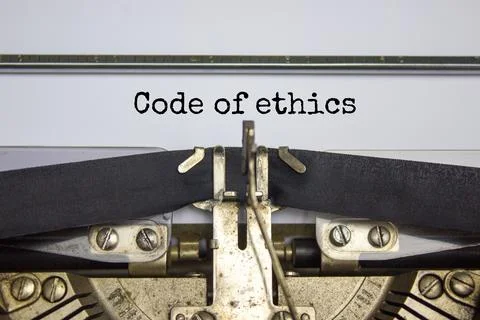 Code of ethics symbol. Words 'Code of ethics' typed on retro typewriter. Busi Stockfoto's