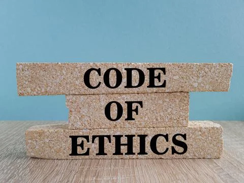 Code of ethics symbol. Words Code of ethics on brick blocks. Stock Photos