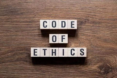 Code of ethics - word concept on building blocks, text Stock Photos
