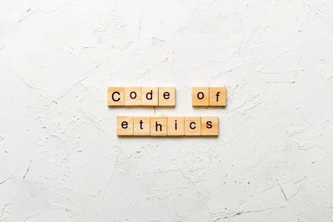 Code of ethics word written on wood block. code of ethics text on table, co.. Stock-Fotos