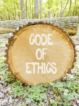 Code of ethics words symbol. Concept words Code of ethics on beautiful wood.. Stockfoto's