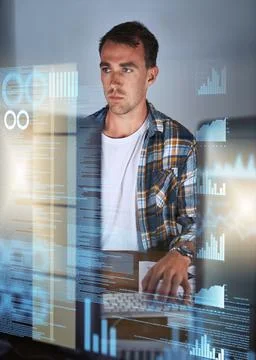 Code is his second language. Shot of a young programmer working at his comput Stock Photos