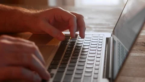 Code on laptop keyboard. Businessman working on tablet computer, Working on Stock-Footage 334586145