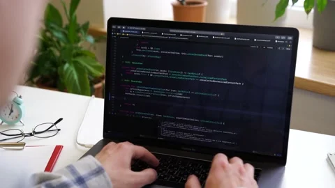 Code on laptop screen, worki in office Stock Footage 149138299