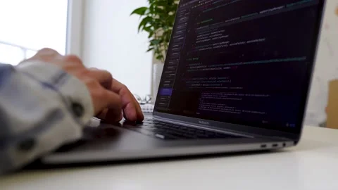 Code on laptop screen, worki in office Stock Footage 149138329