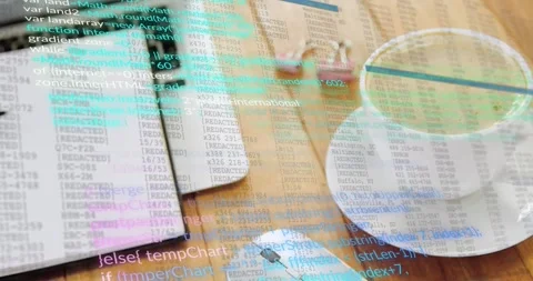 Code lines fading in over wooden desk setup while scrolling downward Stock Footage 318475367