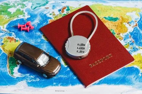 Code Lock on Red Passport, Toy Car, Pushpins on World Map Background. Concept 스톡 사진