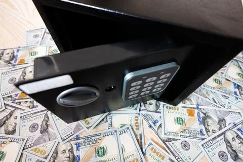 Code lock safe door against dollar money. Stock Photos