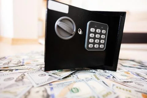 Code lock safe door against dollar money. Stock Photos